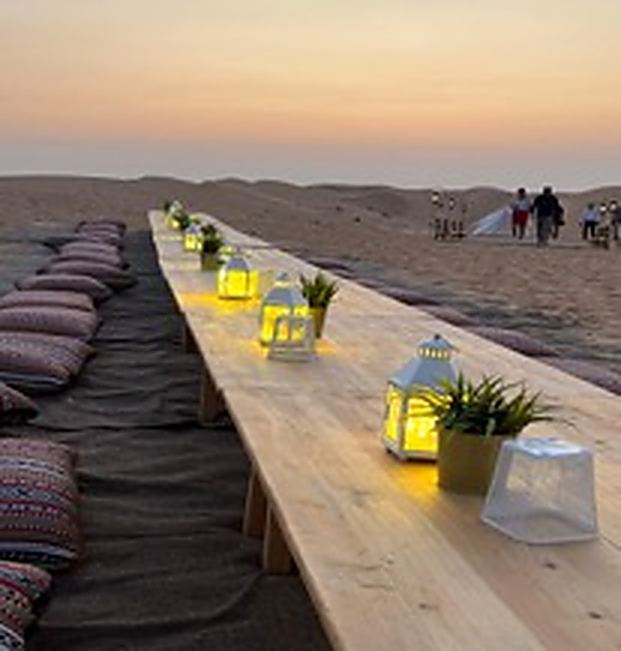 Dining table dressed under canopy lighting
