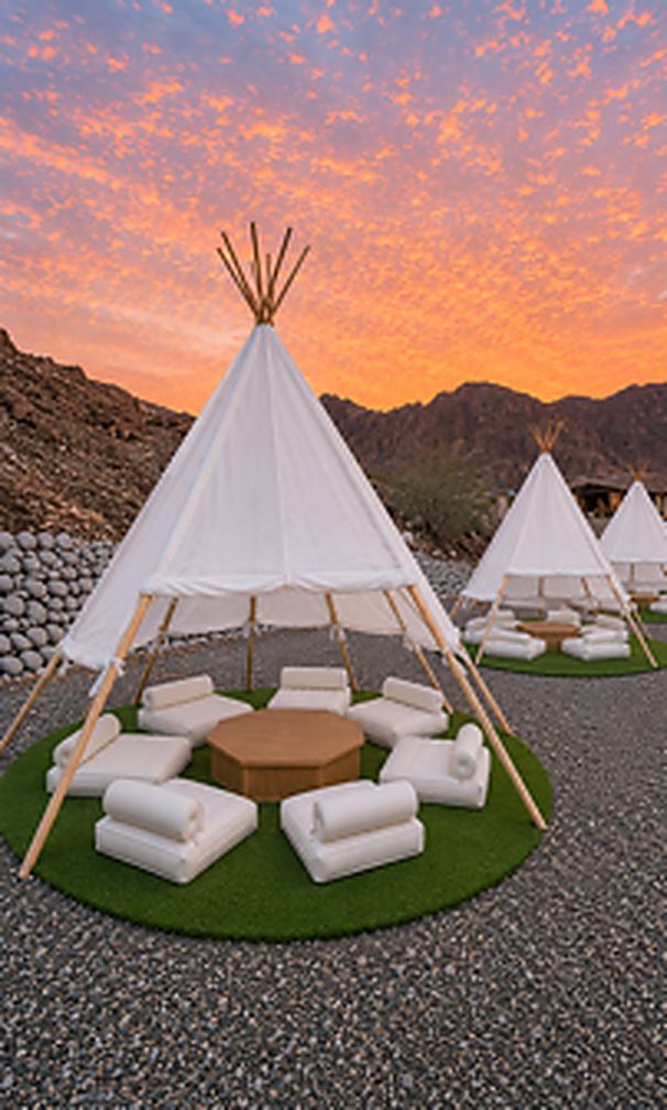Teepees with single-layer summer covers at sunset